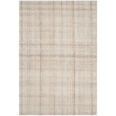 a white rug with plaid pattern on the bottom, and a beige area rug in the middle