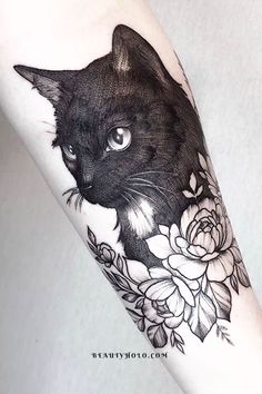 a black cat with flowers on it's arm is shown in this tattoo design