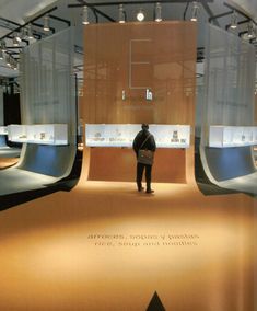 a man standing in front of a display case