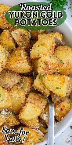 roasted yukon gold potatoes in a white bowl with a spoon and parsley on the side