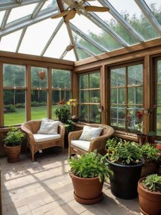 a sun room filled with lots of plants and furniture