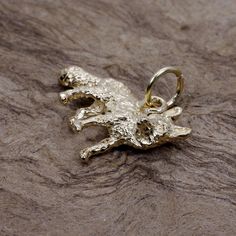 "If you are a fox lover or you know someone who is then they will love the beauty of this three dimensional fox charm for her bracelet. If you are wanting it as a necklace I offer it that way on another listing. This solid 14kt. gold Fox Charm has very fine detail on the front and back and is made entirely of 14kt gold. 14kt gold is a precious metal that shows you like to own real quality and this piece will last a lifetime and can be handed down for many generations. The gold weight of the char Fox Charm, Gold Fox, Animal Bracelet, Fox Lover, Realistic Baby Dolls, Animal Wildlife, Bee Charms, Red Fox, Precious Metal