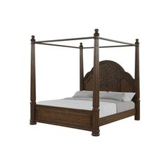 a wooden bed with four posts and white sheets on it's headboard, in front of a white background