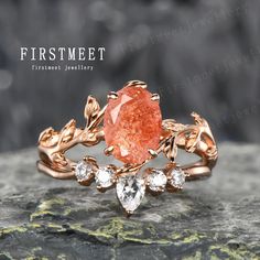 an orange diamond ring with leaves on it