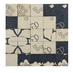 an image of a patchwork design with flowers and hearts on black and white squares