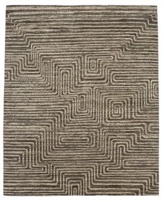 an area rug with wavy lines in grey and beige colors on the floor, including one square