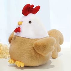 a stuffed animal with a chicken on it's back