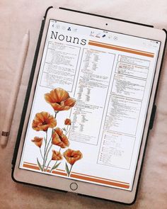 a tablet with an image of orange flowers on it