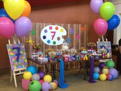 a birthday party with balloons and decorations