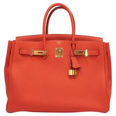 Product Details: Capucine Hermes Togo 35 Birkin Bag. The Togo 35 Birkin bag tote features a leather body, gold-tone hardware, dual rolled top handles, and a front lock closure. 13" L x 9.5" H x 7" D, 5" handle drop. Condition: Pre-owned. Very good. Slight creasing. Includes clochette, keys, lock, and dust bag. Please note this is a pre-owned item that may display signs of wear consistent with the condition listed above and shown in photos. Product Details: Capucine Hermes Togo 35 Birkin Bag. The Display Signs, Hermes Bags, Hermes Bag, Birkin Bag, Hermes Bag Birkin, Fashion Handbags, Dust Bag, Tote Bag, Shoulder Bag