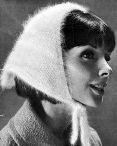 black and white photograph of a woman wearing a knitted hat