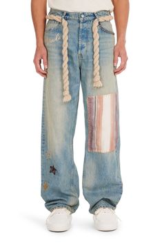 LIGHT WASH THEMED BAGGY JEANS 100% COTTON FIVE-POCKET STYLING MIRACLE & STAR THEMED MOTIFS ALL OVER PATCH DESIGN EMBROIDERED ON LEG EXPOSED STITCHING DESIGN BAGGY FIT NAHMIAS BUTTON CLOSURE BELT LOOPS THICK ROPE BELT SPECIAL WASH TECHNIQUE & TREATMENT DRY CLEAN ONLY SKU: D5-P43-494 SIZE GUIDE Streetwear Jeans Men, Baggy Jeans Outfit, Outfit Hombre, Jeans Outfit Men, Relaxed Trousers, Streetwear Jeans, Rope Belt, Thick Rope, Denim Outerwear