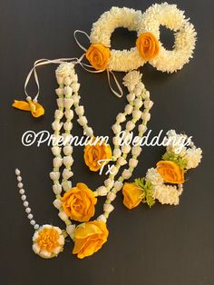 two necklaces with flowers and pearls on them