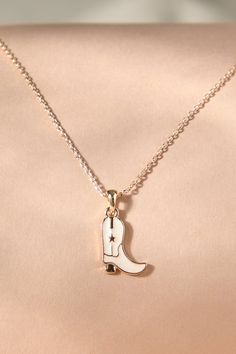 This necklace showcases a miniature cowboy boot pendant, embodying the spirit of the wild west. Crafted with attention to detail, this accessory adds a touch of Western charm to any outfit. Cowgirl Necklaces, Camera Icon, Wedding Branding, Plus Size Shopping, White Shop, Wild West, Dream Jewelry, Cowboy Boots, Charm Necklace