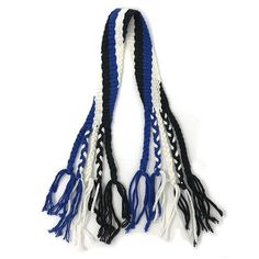 two blue, white and black tassels hanging from a hook