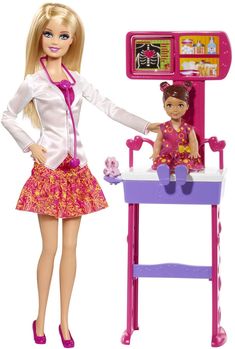 a barbie doll plays with her kitchen set