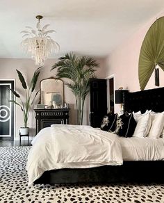 a bedroom decorated in black and white with leopard print flooring