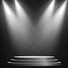 an empty stage with three spotlights in the center and steps to the right on a black background