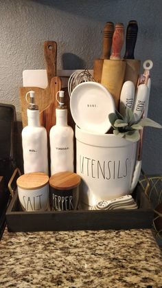 the kitchen utensils are organized in a tray