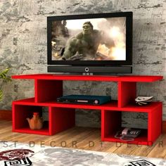 a red entertainment center with a television on it