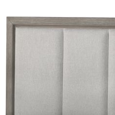 a close up view of the side of a headboard with pleaed fabric panels