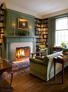 a living room filled with furniture and a fire place in the middle of a room