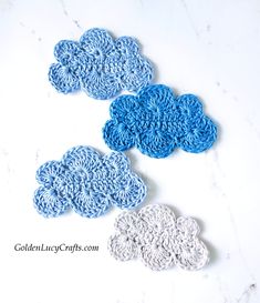 three crocheted coasters sitting on top of a white counter