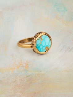 14k Yellow Gold Turquoise Band Width: .125" Stone Size: .25" All Stones May Vary in Size, Shape and Color Ethically Handcrafted in Ojai, California. Turquoise Gemstone Brass Jewelry, Handmade Yellow Gold Turquoise Ring, Gold Turquoise Ring With Gemstone, Handmade Turquoise Ring In Yellow Gold, Artisan Gold Turquoise Ring, Turquoise 14k Gold Jewelry With Bezel Setting, Bohemian 14k Gold Round Rings, Turquoise Ring With Patina, Gold Turquoise Ring For Anniversary