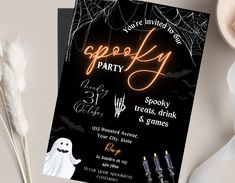 a halloween party flyer with ghost and candles