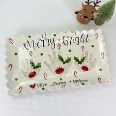 a merry and bright tray with handprinted christmas decorations