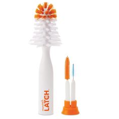 an orange and white toothbrush sitting next to each other