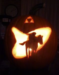 a pumpkin carved to look like a horse and rider