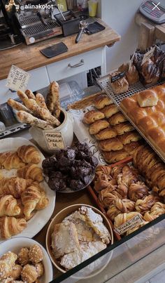 various pastries and desserts on display in a bakery