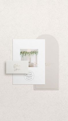 the wedding stationery is laid out on top of each other