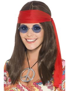 a woman wearing sunglasses and a peace sign headband