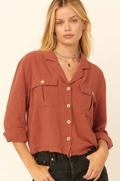 Solid, linen-blend shirt. Notched lapel collar. Button-front closure with wood buttons. Buttoned flap chest pockets. Long sleeves with buttoned cuffs. Yoke back. Frayed raw-edge hem. Relaxed fit. 70% Rayon, 30% Linen. Imported. Designed in LA. Model wears size S. Wood Buttons, Pocket Shirt, Inner Strength, Lapel Collar, Raw Edge, Chest Pocket, Linen Blend, Rust, Ruffle Blouse