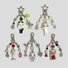 several key chains with charms attached to them