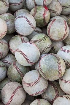 a pile of baseballs sitting on top of each other