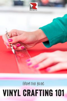 a woman's hands with pink nail polish on top of a red table and the words from the blog vinyl crafting 101