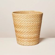 a large woven basket sitting on top of a table