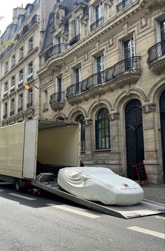 a truck with a large mattress on the back of it