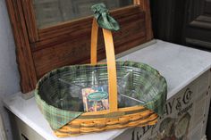 a basket sitting on top of a window sill next to a sign and door