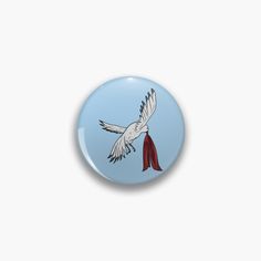 a blue button with a white bird flying in the sky