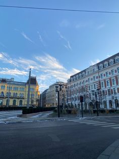 an empty street in front of some buildings