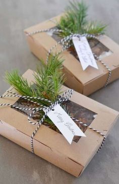 two brown boxes with tags tied to them