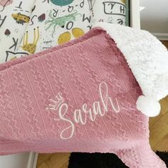 a pink blanket with the word sarah written on it