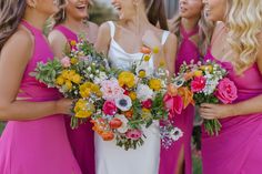 the bride and her bridesmaids are laughing together