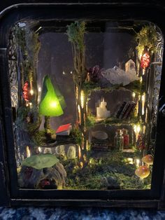 a display case filled with lots of different types of decorations and lights on it's sides