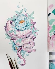 a drawing of a flower and two snakes