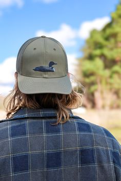 Inspired by summers spent up north at the lake, this Common Loon was painted using acrylics paints. This classic style cap is exactly what you need!  This hat takes on a casual structured shape and has a pre-curved visor!  Made with a cotton-poly blend and a nylon mesh, and finished with a cotton sweatband for maximum comfort and breathability.  This hat is a structured, 6-panel cap that has a snapback, adjustable closure!  Fit is a medium/large!  Design is hand-painted and printed by me!  Ships in 24 hours or less in a box for maximum protection! Bird Hat, Common Loon, Nature Gifts, 6 Panel Cap, Bird Gifts, Fishing Hat, Up North, Hats Snapback, At The Lake